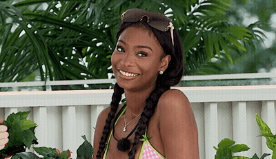 Woman In Sunglasses And Braided Hair Smiling GIF