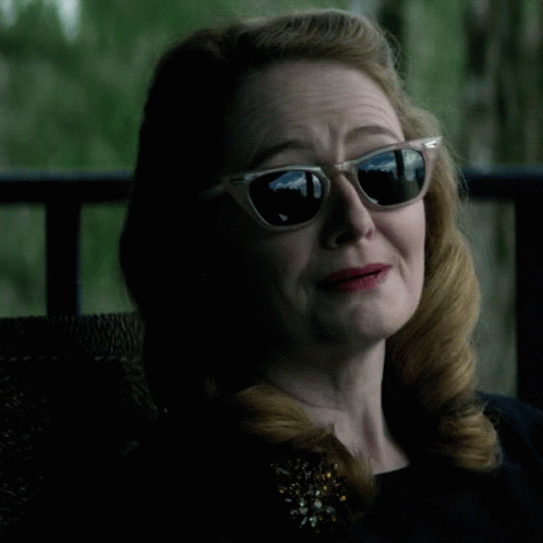 Woman In Sunglasses And Brooch With Word Praise GIF