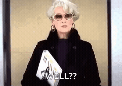 Woman In Sunglasses And Fur Coat Holding Laptop And Magazine Saying Well GIF