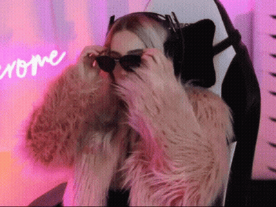 Woman In Sunglasses And Fur Coat Sitting GIF