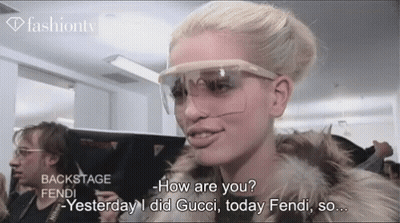 Woman In Sunglasses And Fur Coat Talking Gucci GIF