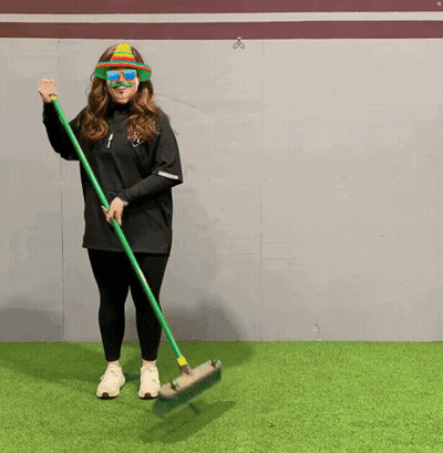 Woman In Sunglasses And Hat Holding Broom GIF