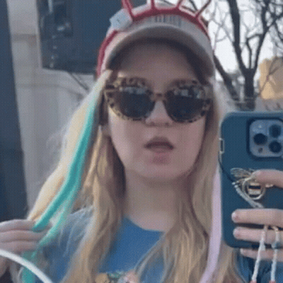 Woman In Sunglasses And Hat Taking Selfie GIF