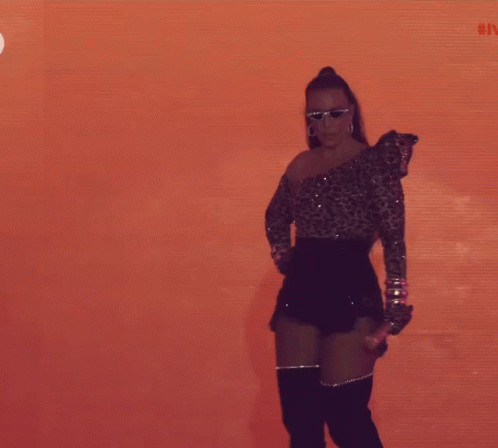 Woman In Sunglasses And Leopard Print Top Dancing GIF