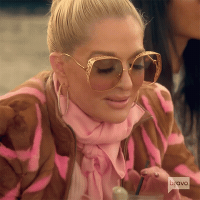 Woman In Sunglasses And Pink Scarf With Bravo Shirt GIF