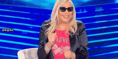 Woman In Sunglasses And Pink Shirt Saying Love GIF