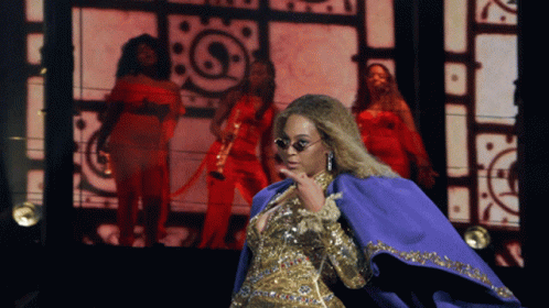 Woman In Sunglasses And Purple Cape GIF