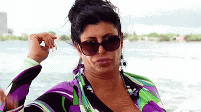 Woman In Sunglasses And Purple Dress On Boat GIF