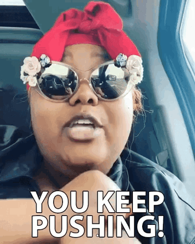Woman In Sunglasses And Red Headband Saying You Keep Pushing GIF