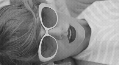 Woman In Sunglasses And Red Lipstick Lying Down GIF