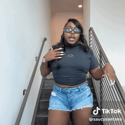 Woman In Sunglasses And Shorts On Stairs TikTok GIF