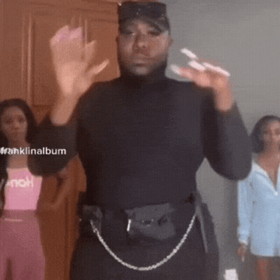 Woman In Sunglasses And Shorts On Stairs With TikTok Watermark GIF