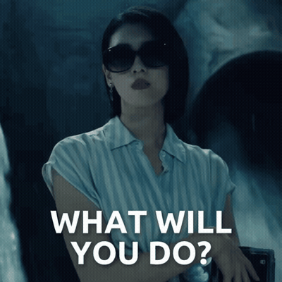 Woman In Sunglasses And Striped Shirt Saying What Will You Do GIF