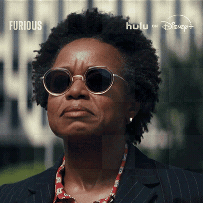 Woman In Sunglasses And Suit For Furious On Hulu GIF
