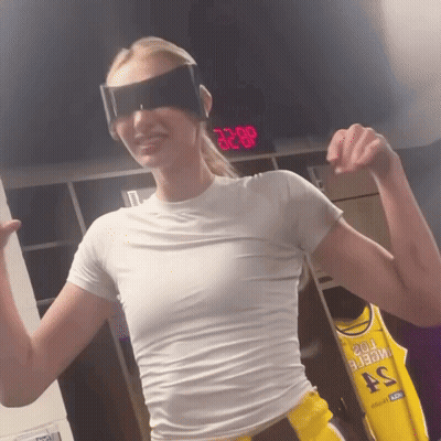 Woman In Sunglasses And White Shirt In Front Of Digital Clock 3:28 GIF