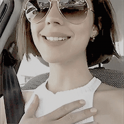 Woman In Sunglasses And White Tank Top GIF