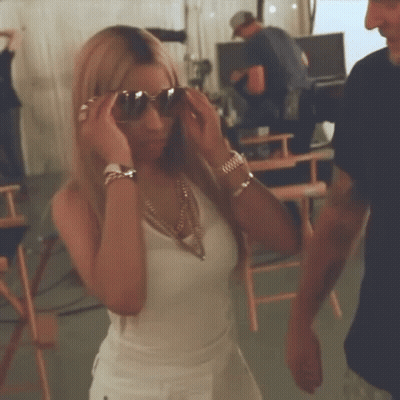 Woman In Sunglasses And White Tank Top GIF