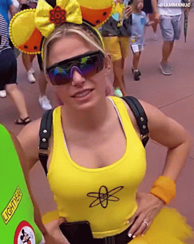 Woman In Sunglasses And Yellow Tank Top With Atom GIF