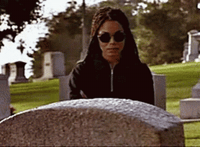 Woman In Sunglasses At Grave GIF