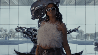 Woman In Sunglasses At Large Window GIF