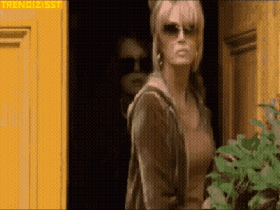 Woman In Sunglasses At Yellow Door GIF