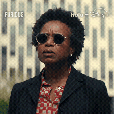 Woman In Sunglasses Before Furious Sign GIF