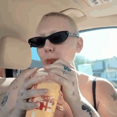 Woman In Sunglasses Drinking From Cup GIF