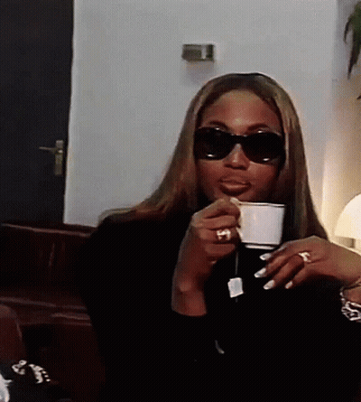 Woman In Sunglasses Drinking Tea GIF