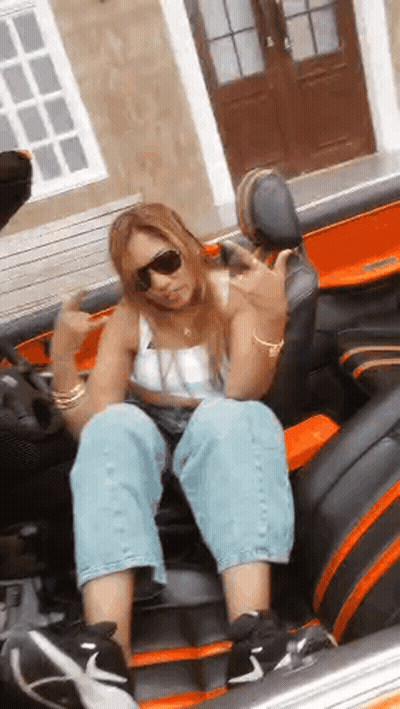 Woman In Sunglasses Giving Middle Finger In Car GIF