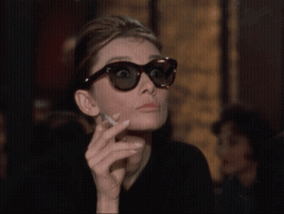 Woman In Sunglasses Holding Cigarette GIF