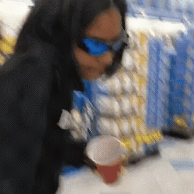 Woman In Sunglasses Holding Cup GIF