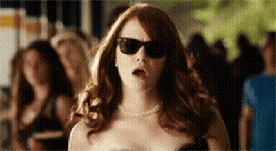 Woman In Sunglasses In Front Of Crowd GIF