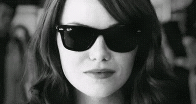 Woman In Sunglasses Making Face In Black And White GIF