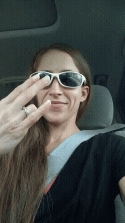 Woman In Sunglasses Making Funny Face With Wedding Ring GIF