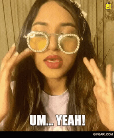 Woman In Sunglasses Making Peace Sign Saying Um Yeah GIF