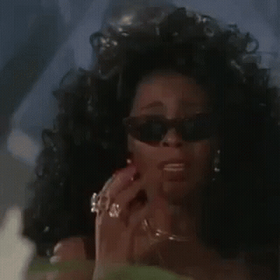 Woman In Sunglasses Ring Talking On Phone GIF