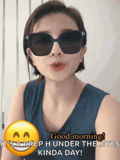 Woman In Sunglasses Says Good Morning It's A Prep Under The Eyes Kinda Day GIF