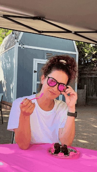 Woman In Sunglasses Sitting At Table With Food GIF