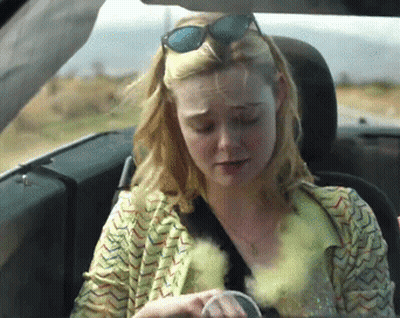 Woman In Sunglasses Sitting In Car GIF