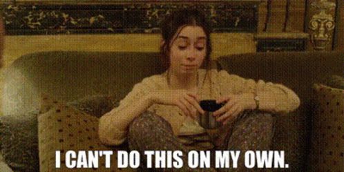 Woman In Sunglasses Sitting On Bed GIF