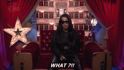 Woman In Sunglasses Sitting On Couch Saying What GIF