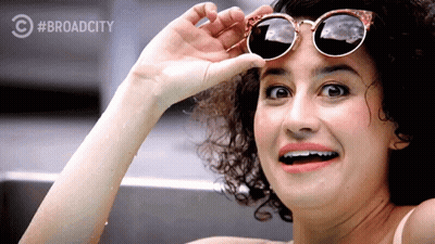 Woman In Sunglasses Smiling With Broadcity Logo GIF