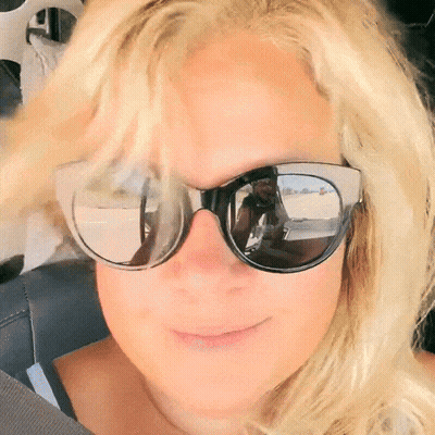 Woman In Sunglasses Taking Selfie In Mirror GIF