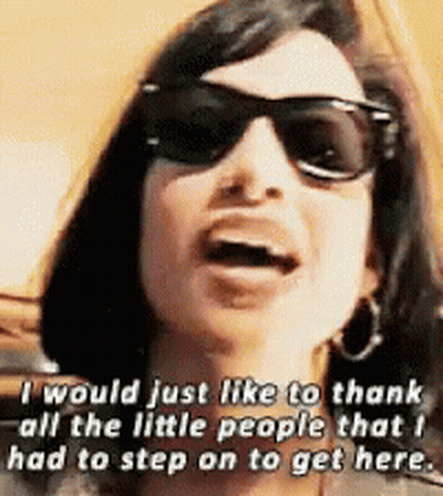Woman In Sunglasses Thanking Little People GIF