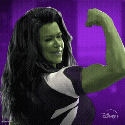 Woman in Superhero Costume Flexing Muscles