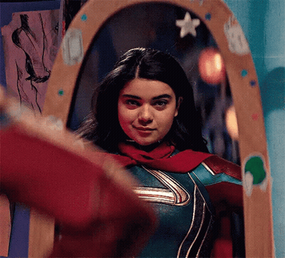Woman in Superhero Costume Standing in Front of Mirror
