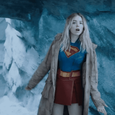 Woman In Superman Costume At Cave GIF