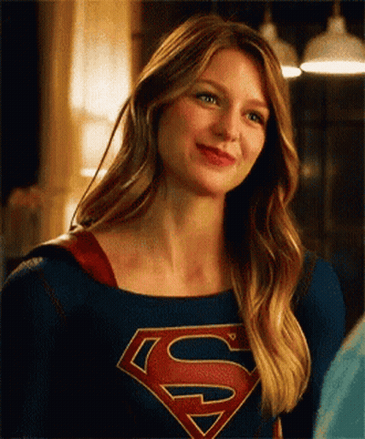 Woman In Superman Costume Smiling GIF
