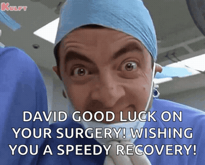 Woman In Surgical Mask And Blue Hat With Surgeons GIF