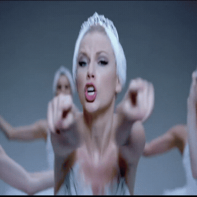 Woman In Swan Costume Pointing At Camera GIF